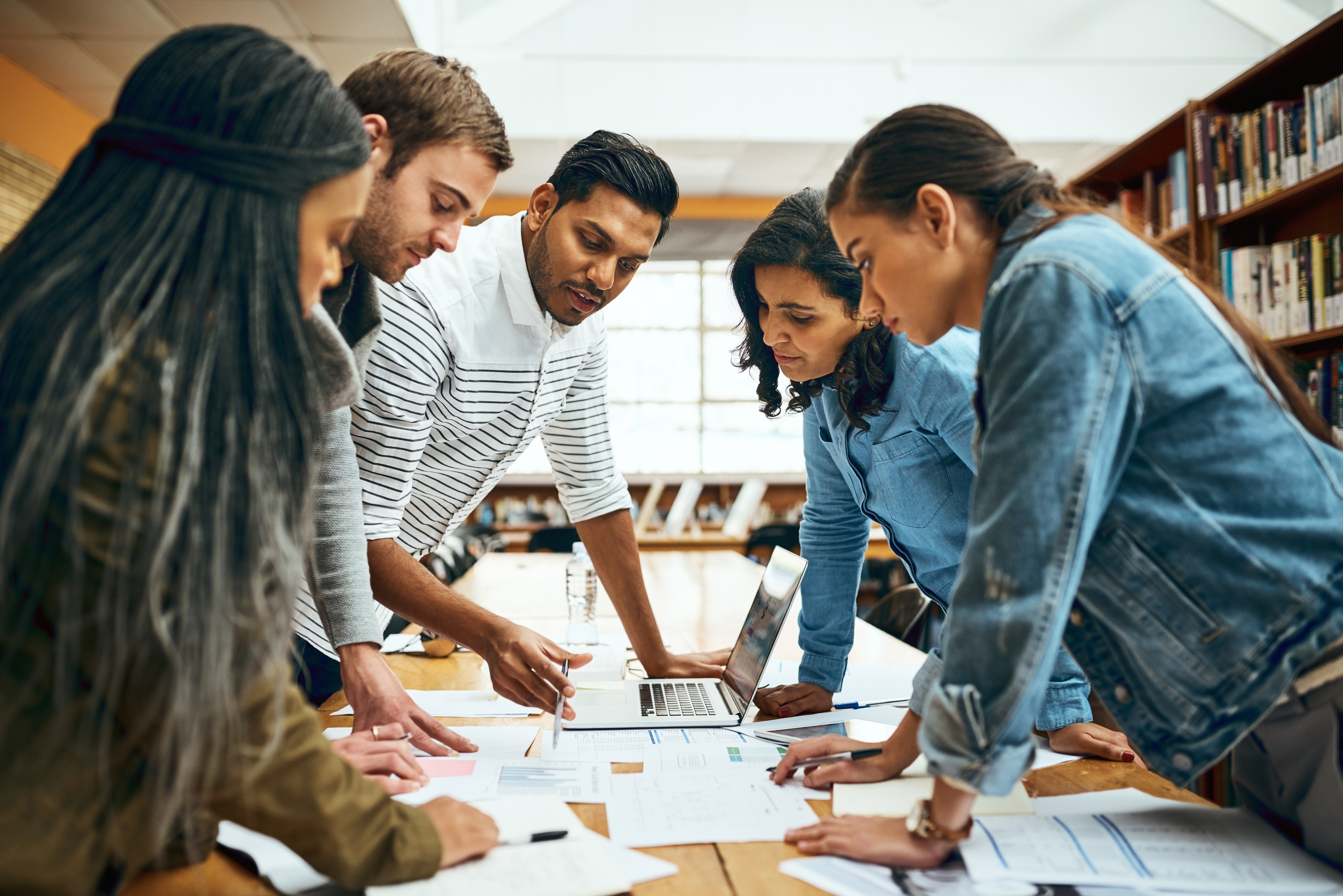 People standing around a table